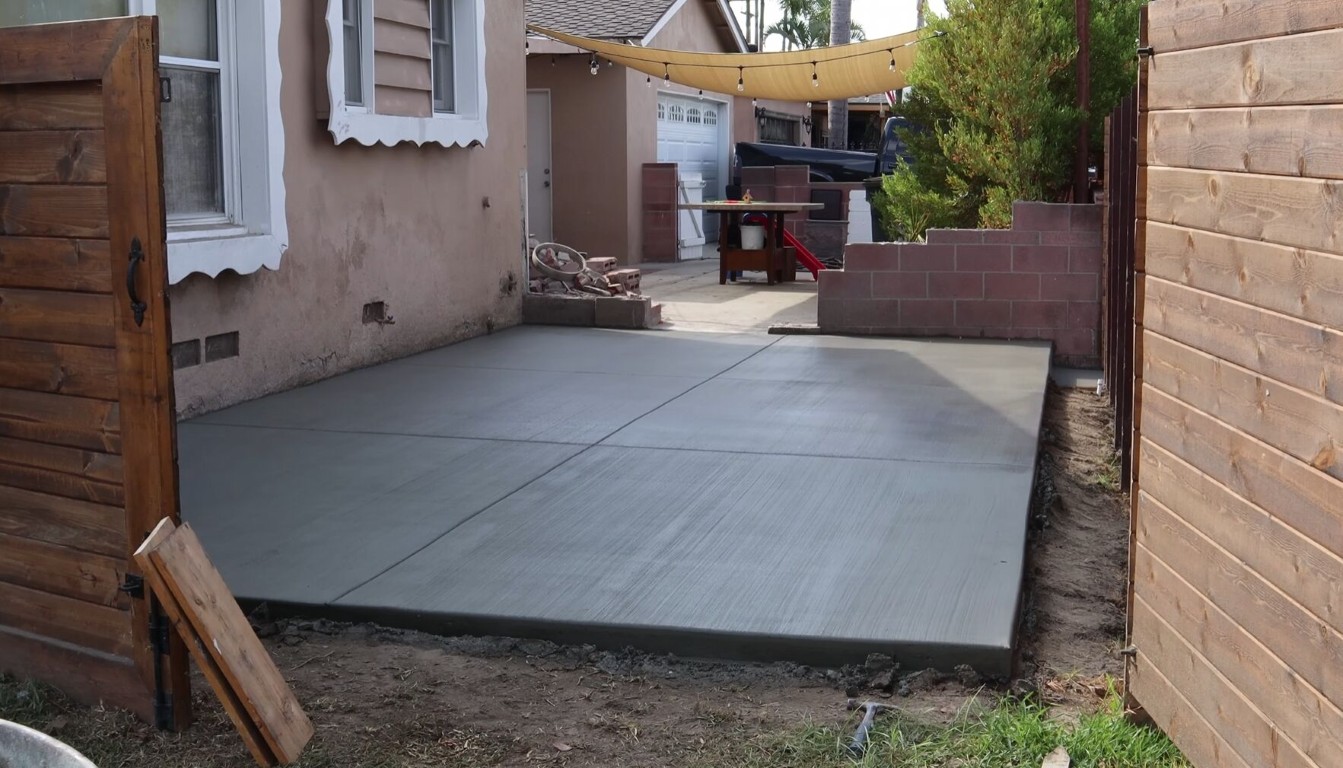 Beautiful custom concrete patio installation in Watsonville backyard