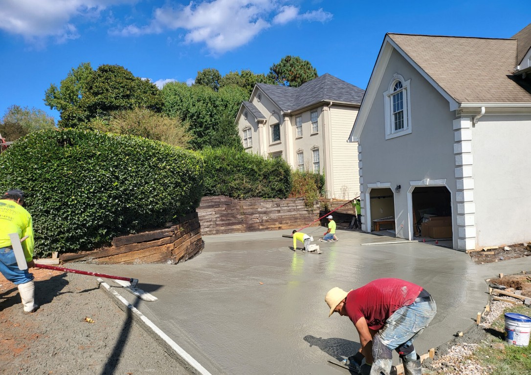 Experienced concrete crew finishing residential driveway in Watsonville